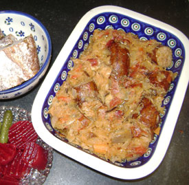 Kielbasa and sauerkraut served with sweet beets and brown bread